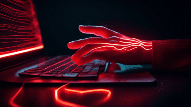 A hand with glowing red lines illustrating carpal tunnel syndrome reaching towards a computer keyboard in a dimly lit office.